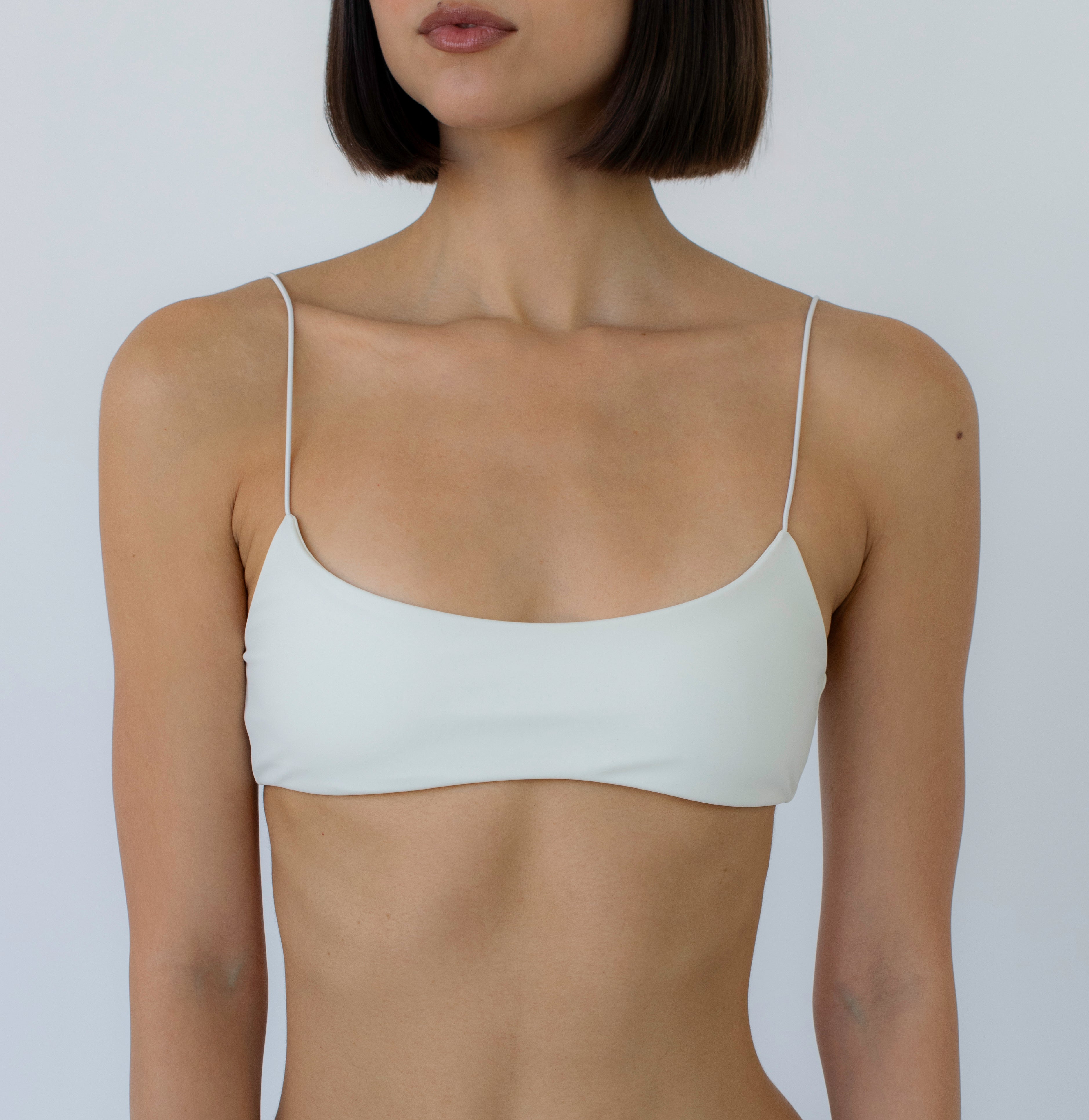 ivory bralette bikini top on a model with a white background