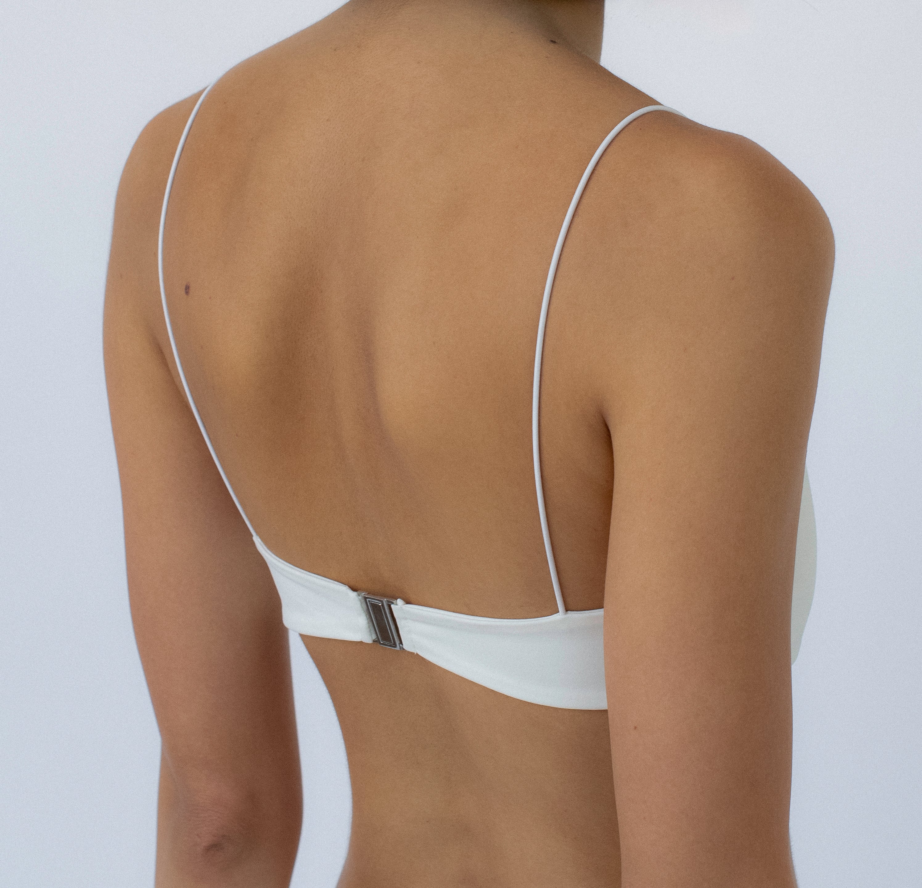 ivory bralette bikini top on a model with a white background