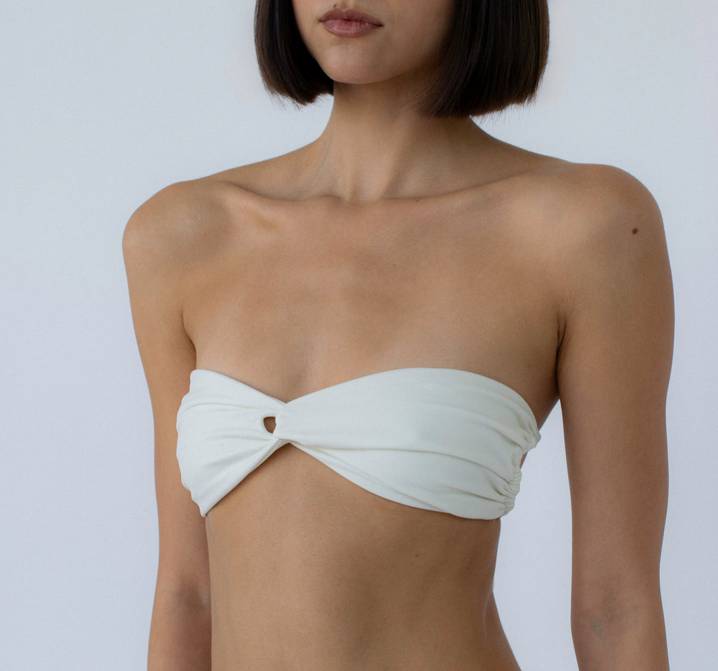 ivory twisted bandeau bikini top on model